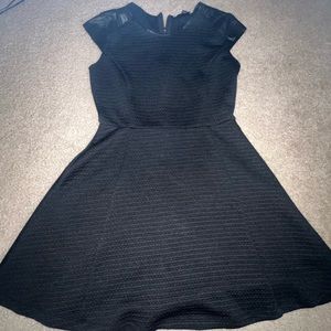 Women’s knee length black waffle texture dress, faux leather cap sleeves Medium